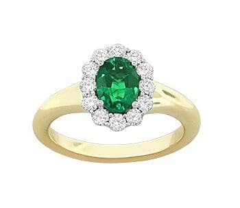 Oval emerald halo ring in 18K two-tone gold with yellow gold band and diamonds, size 6.5.